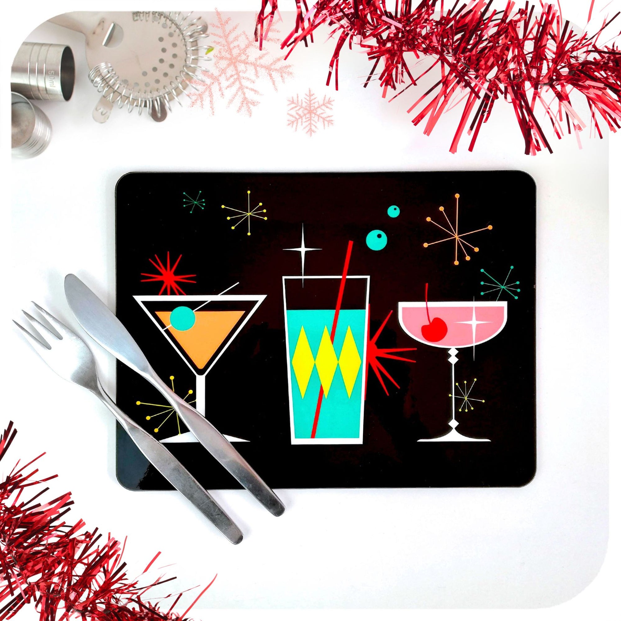 Placemat with retro cocktail design on a white surface with festive decorations | The Inkabilly Emporium