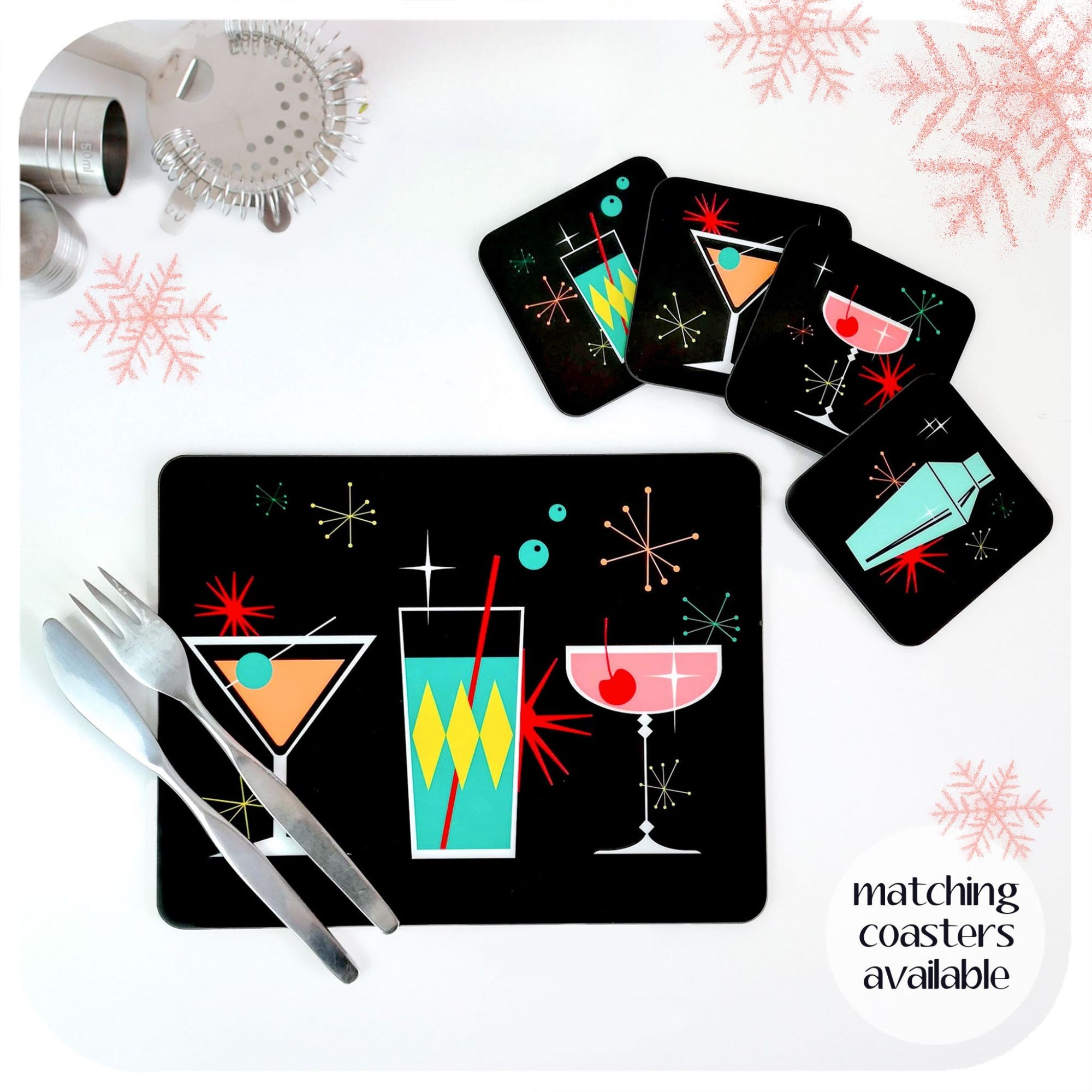 A placemat featuring mid century style cocktails on a white table with matching coasters, cutlery, cocktail making equipment. Text reads: Matching coasters available | The Inkabilly Emporium