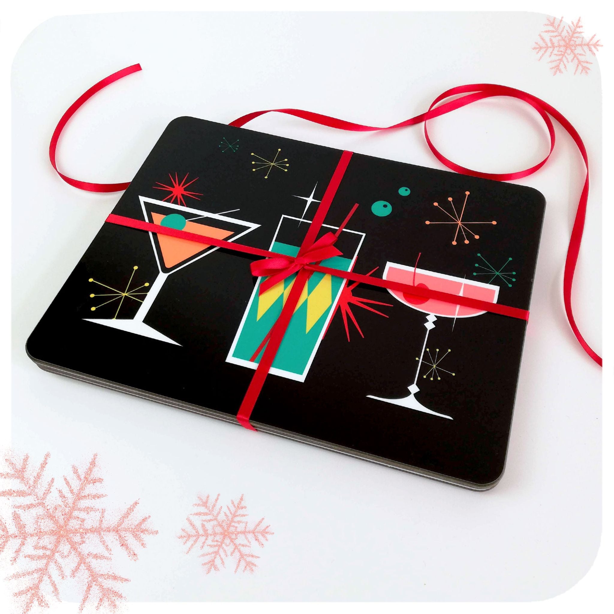 A set of four placemats with cocktail design tied with red ribbon on a white background | The Inkabilly Emporium