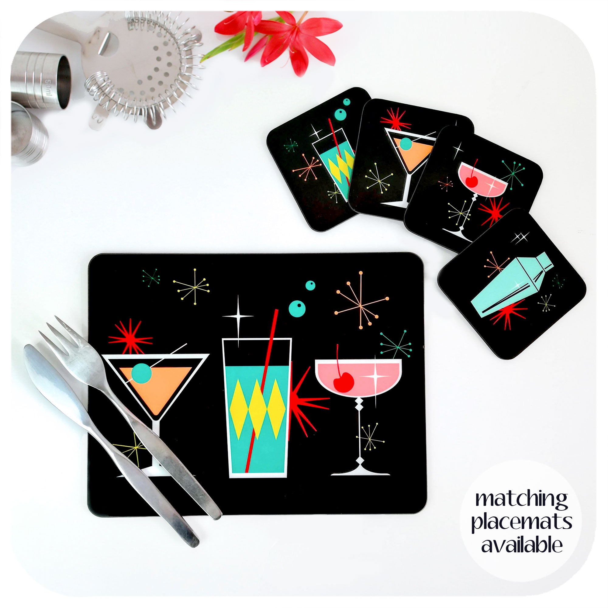 Set of four square retro cocktail coasters and a single matching placemat lie on a white table with cocktail making equipment and cutlery. Text in bottom right hand corner reads: matching placemats available | The Inkabilly Emporium