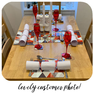 Customer photo of Scandi Geometric Placemats and Coasters on Christmas Table spread with candles, wine glasses and crackers | The Inkabilly Emporium