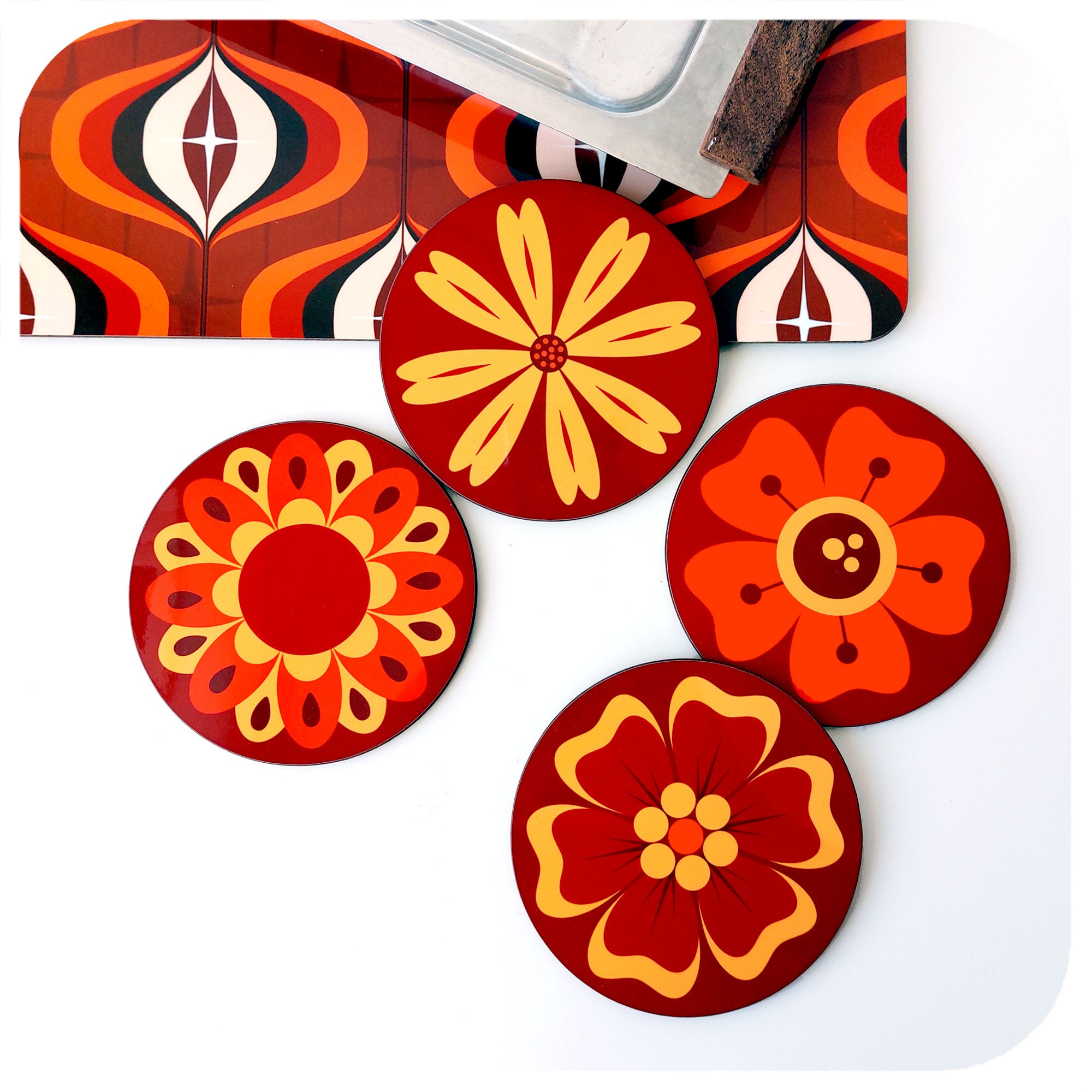 A set of four 70s style floral coasters on a white background with vintage accessories | The Inkabilly Emporium