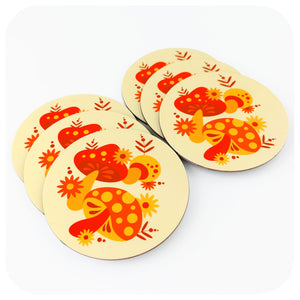 Set of 6 70s style retro coasters featuring orange, red & yellow mushrooms, on a white background | The Inkabilly Emporium