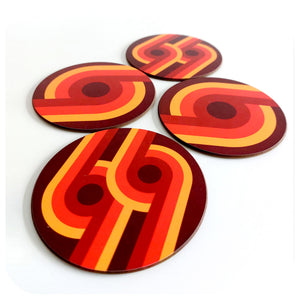 Close up of four 70s supergraphic coasters on a white background | The Inkabilly Emporium