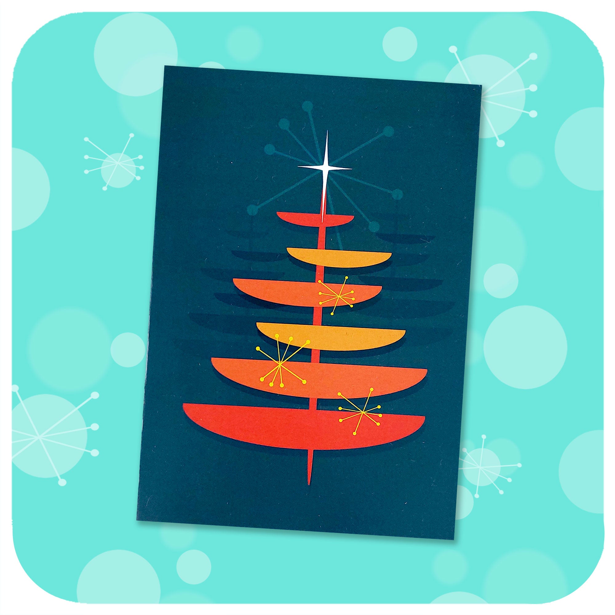 Retro Christmas Tree Card on blue graphic background with 50s style starbursts | The Inkabilly Emporium