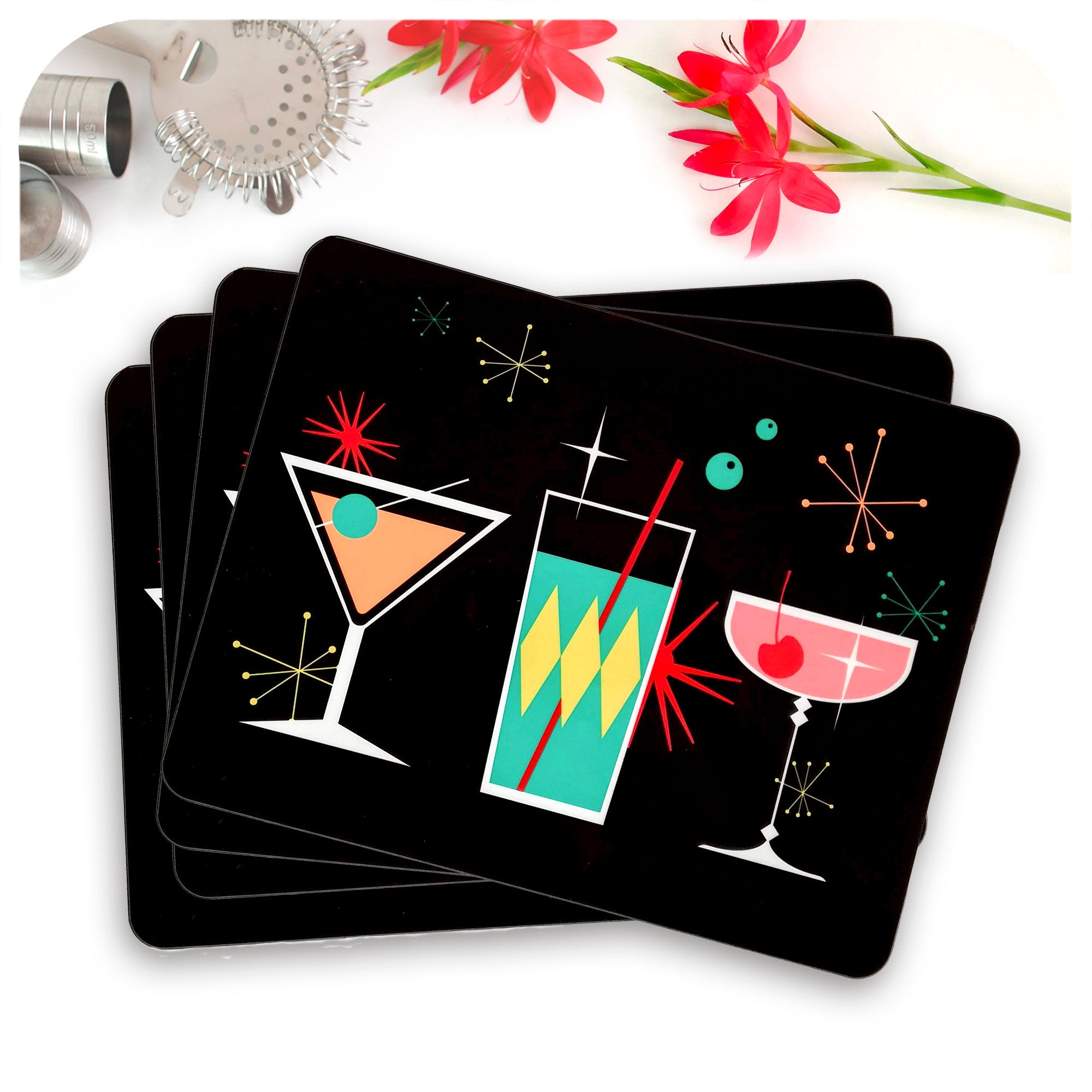 Cosmic Cocktail Placemats, set of 4 laid out in a fan, with cocktail accessories and flower | The Inkabilly Emporium