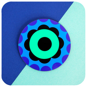 One 60s Flower Power round coaster on a blue & green colourful background | The Inkabilly Emporium