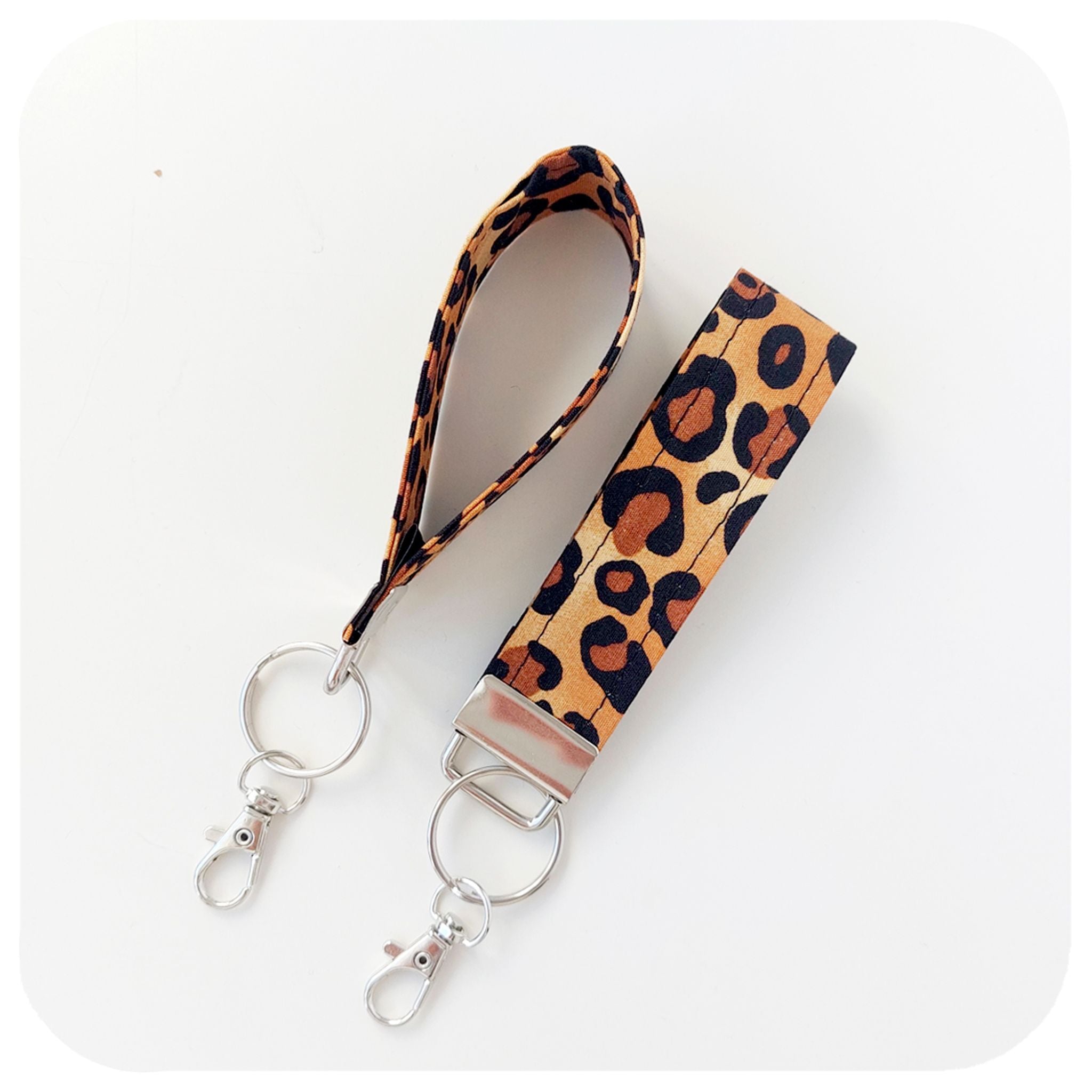 Leopard print keychain with a metal clip on a white background | The Inkabilly Emporium