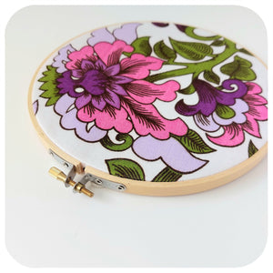 Floral embroidery hoop on a white background