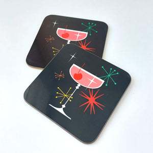 Two coasters with retro cocktail design on a white background