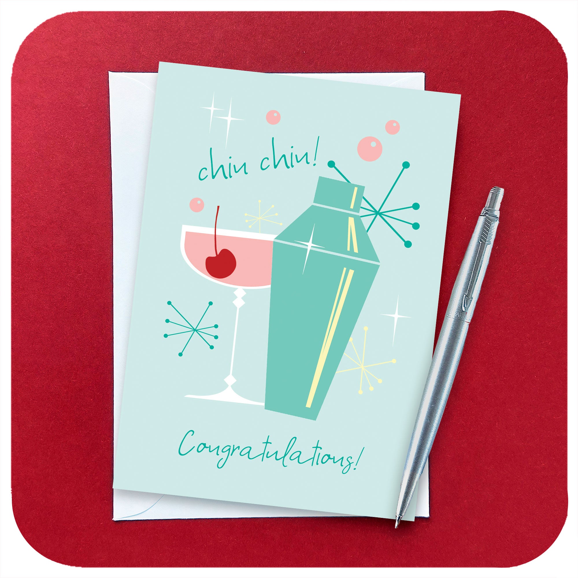 Retro 50s style Congratulations Card featuring retro cocktail and cocktail shaker with white envelope and chrome pen on a dark red background | The Inkabilly Emporium