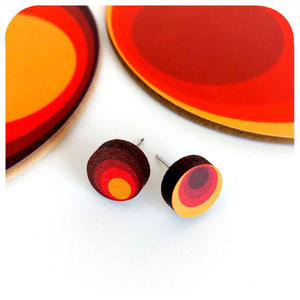Colourful circular earrings with a white background