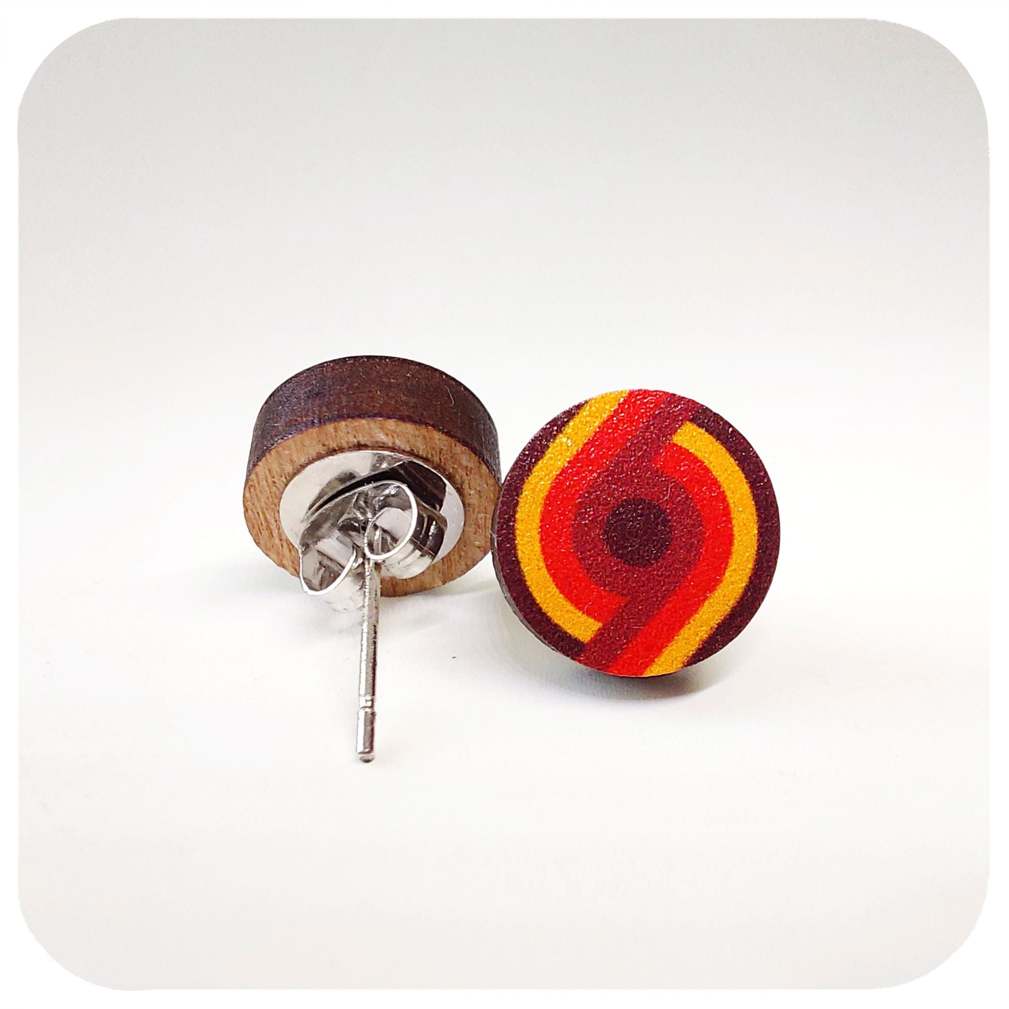 Round earrings with a red and yellow design on a white background | The Inkabilly Emporium