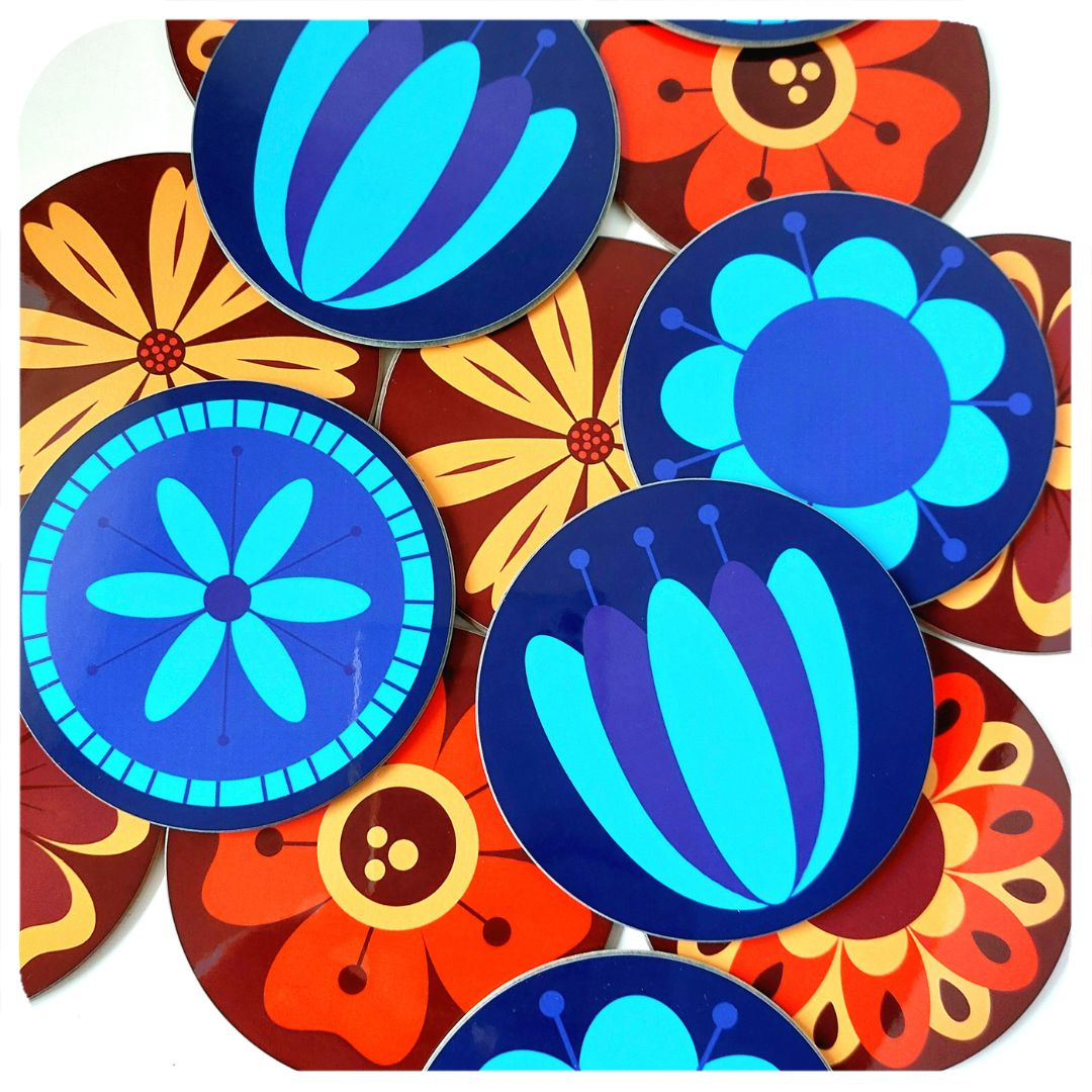Colourful floral coasters on a white background