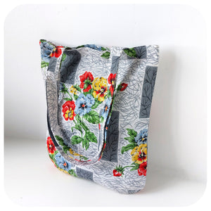 Floral-patterned tote bag on a white background