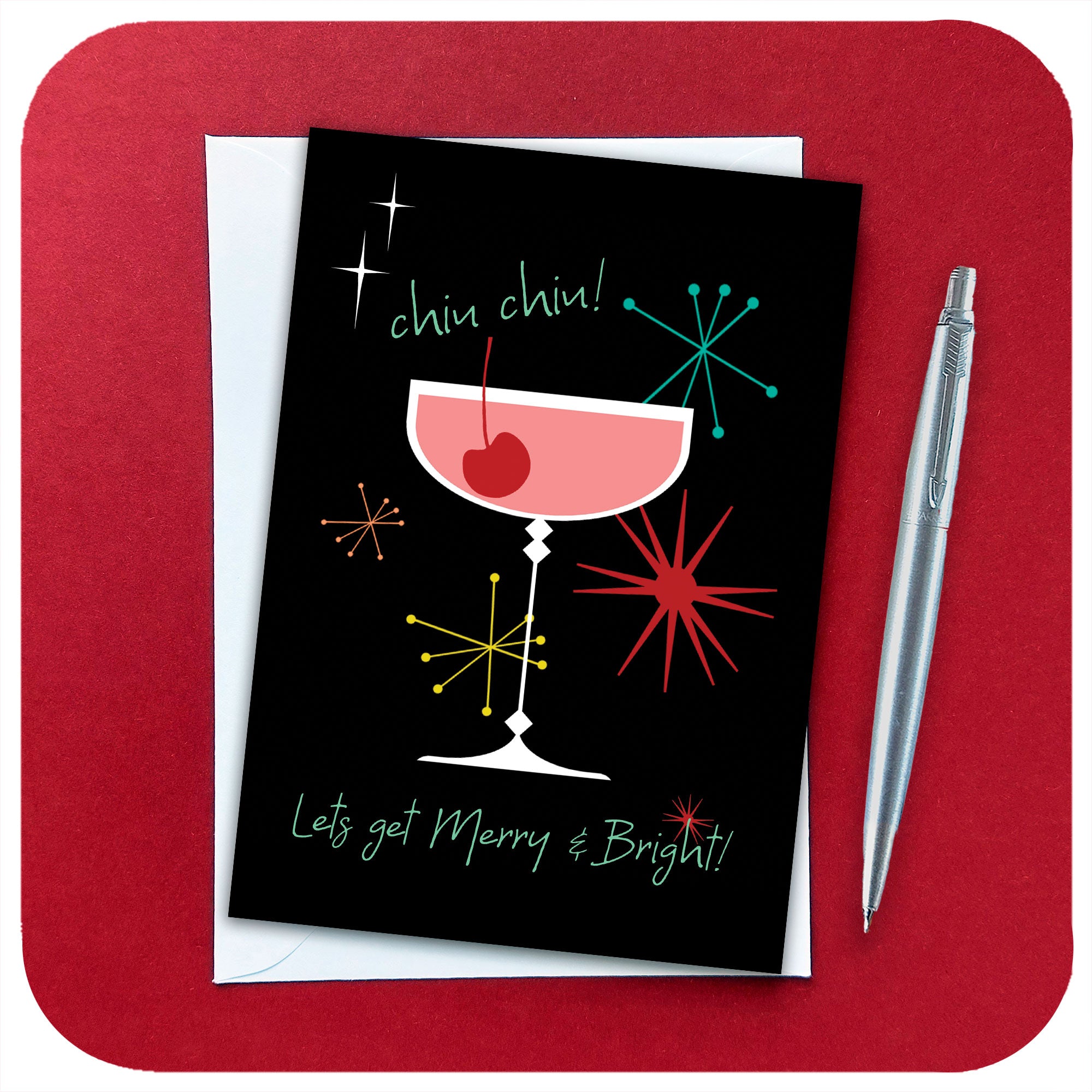 Chin chin! Let's Get Merry & Bright!Mid century style Christmas card with white envelope and silver pen on a red background | The Inkabilly Emporium