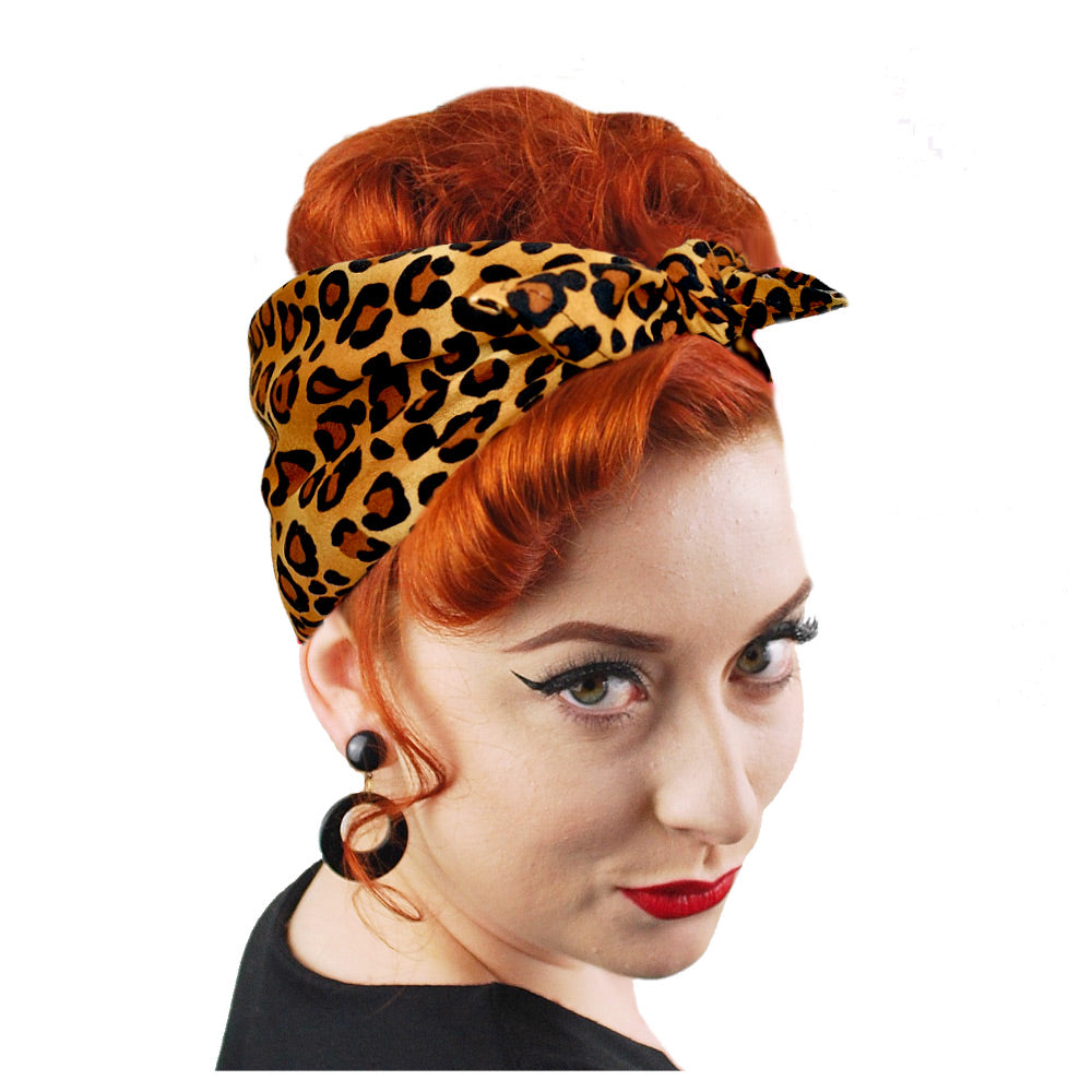 Leopard Print Bandana worn in a Rosie the Riveter style by a model with auburn hair | The Inkabilly Emporium