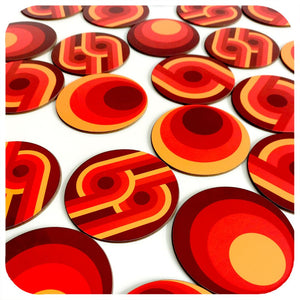 Collection of red and orange circular coasters on a white background