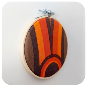  Framed vintage fabric hoop in 70s graphic- side view on a white wall | The Inkabilly Emporium