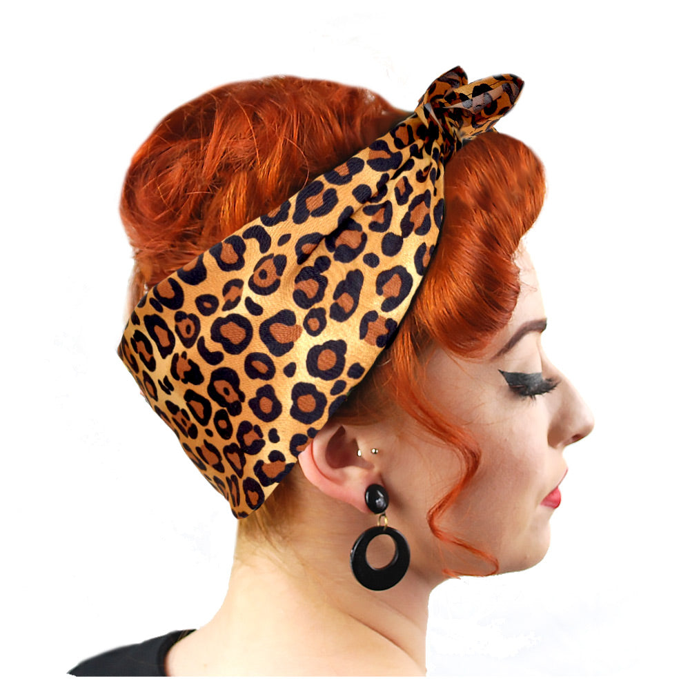 Side view of a Leopard Print Bandana worn in a Rosie the Riveter style by a model with auburn hair | The Inkabilly Emporium