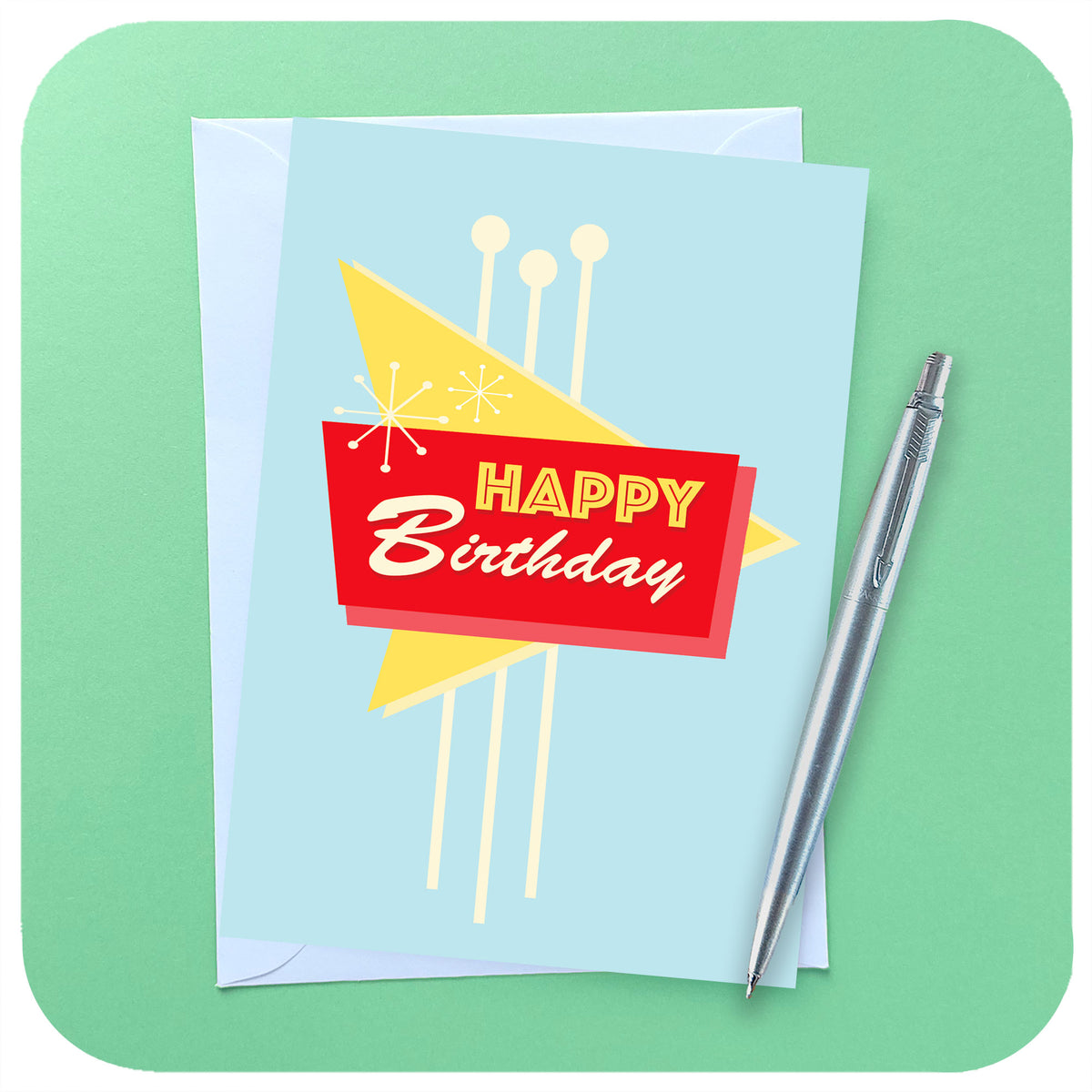 Happy Birthday Card in Vintage Las Vegas Style, with white envelope and silver parker pen on a light green background | The Inkabilly Emporium