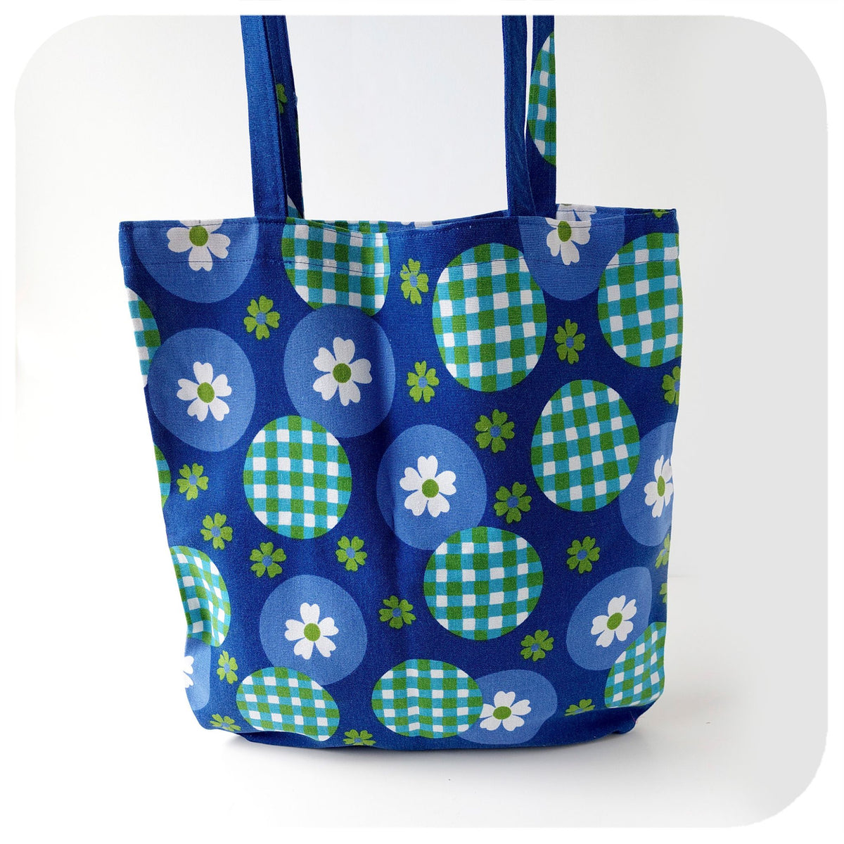 Tote bag with blue and green pattern on a white background