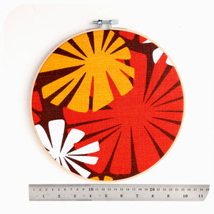 A framed vintage fabric hoop lies next to a ruler to show scale | The Inkabilly Emporium