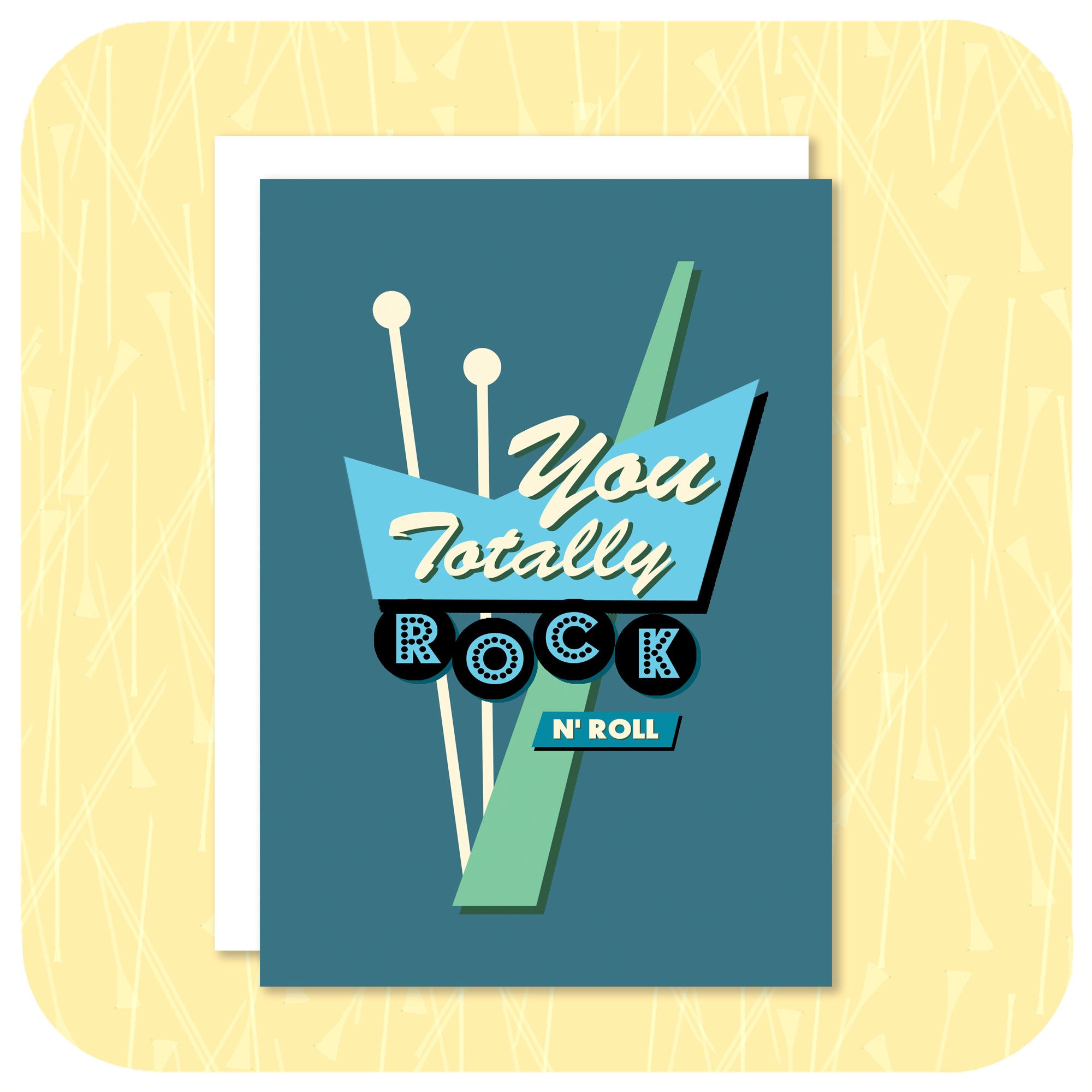 An A6 greetings card featuring a graphic rendering of a 50s style American roadside neon sign in blues and greens, with the words "You Totally Rock n Roll" sits on a white envelope against a light yellow textured background | The Inkabilly Emporium