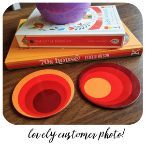 Customer photo of 2 70s circles coasters sitting on a wooden table next to a stack of retro books | The Inkabilly Emporium