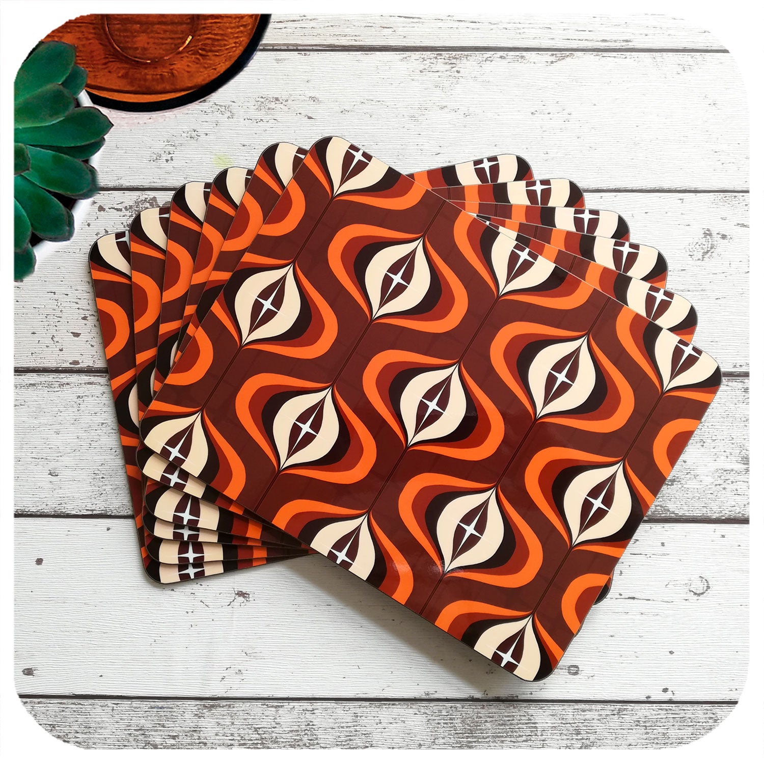 1970s Op Art Placemats in Brown and Orange, set of 6 laid out in a fan | The Inkabilly Emporium