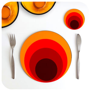 A 70s style round placemat and matching coaster on a white table with vintage mid century knife and fork, and two vintage glass  bowls | The Inkabilly Emporium