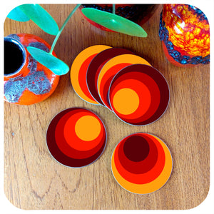 Set of Six Round 70s style coasters on a teak table with fat lava vases and house plant | The Inkabilly Emporium
