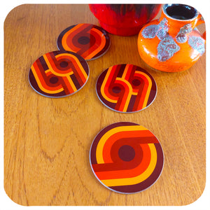 Set of four 70s supergraphic coasters on a teak table with fat lava vases | The Inkabilly Emporium