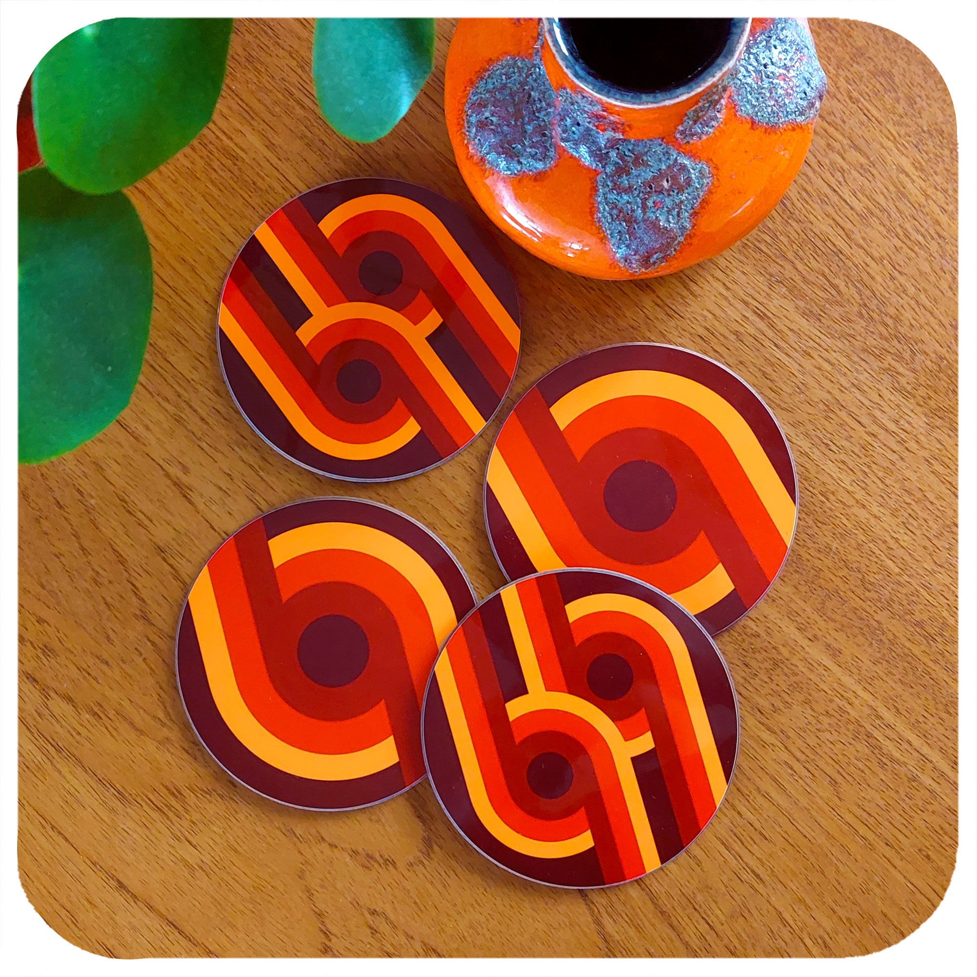 Set of four 70s supergraphic coasters on a teak table with fat lava vase | The Inkabilly Emporium