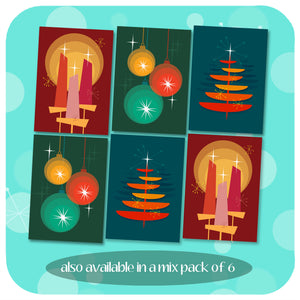 A graphic representation of 6 Christmas Cards, 2 of each design featuring a Christmas Tree, Trio of Christmas Baubles and a trio of Christmas Candles. All in a  Mid Century Modern graphic style on a patterned blue background of Christmas sparkles. Text along bottom reads: also available in a mix pack of 6 