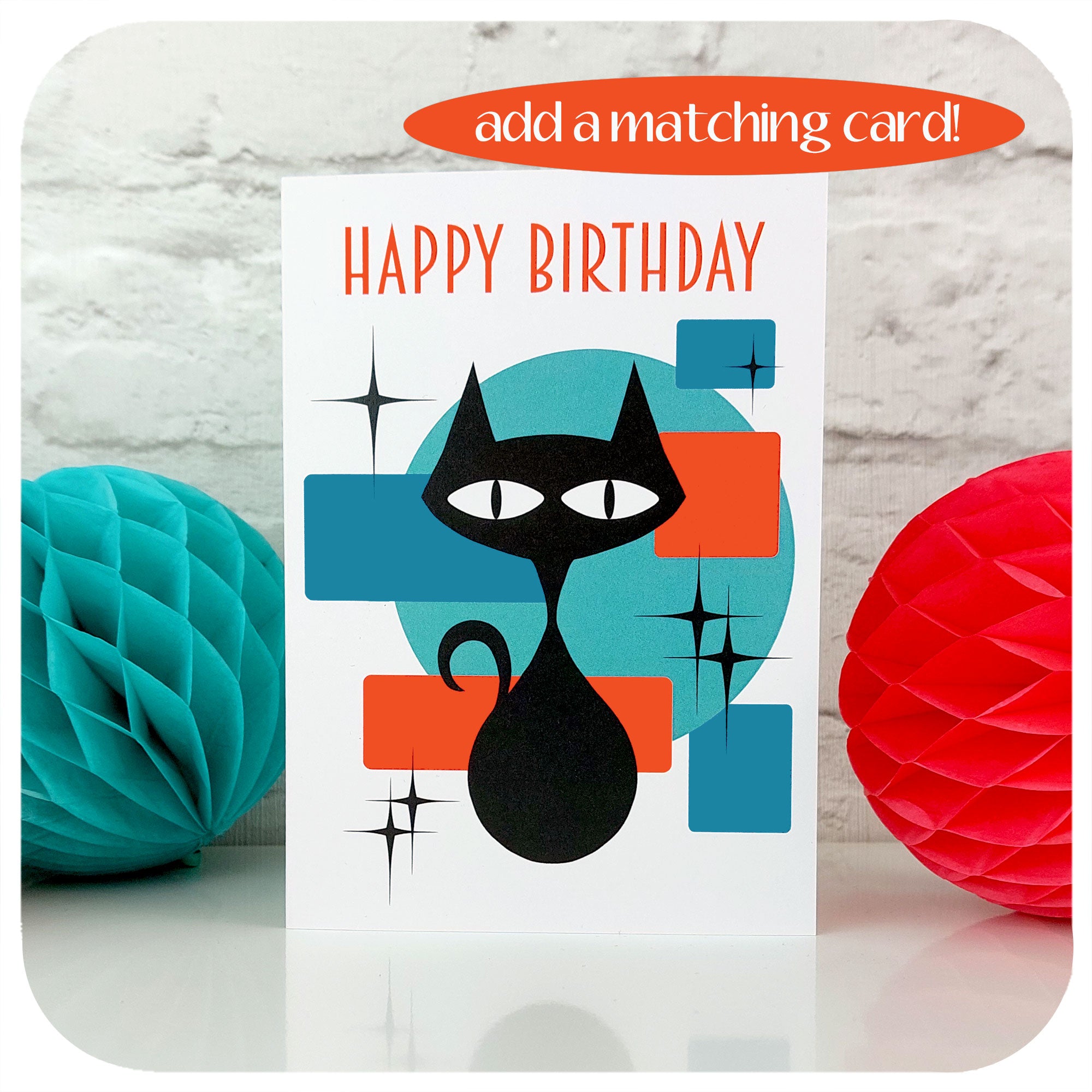 Atomic Cat Birthday Card standing with retro paper party decorations, info graphic in corner say "add a matching card" | The Inkabilly Emporium