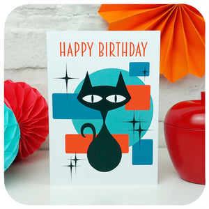 Atomic Cat Birthday Card standing on a white table with retro party decorations | The Inkabilly Emporium