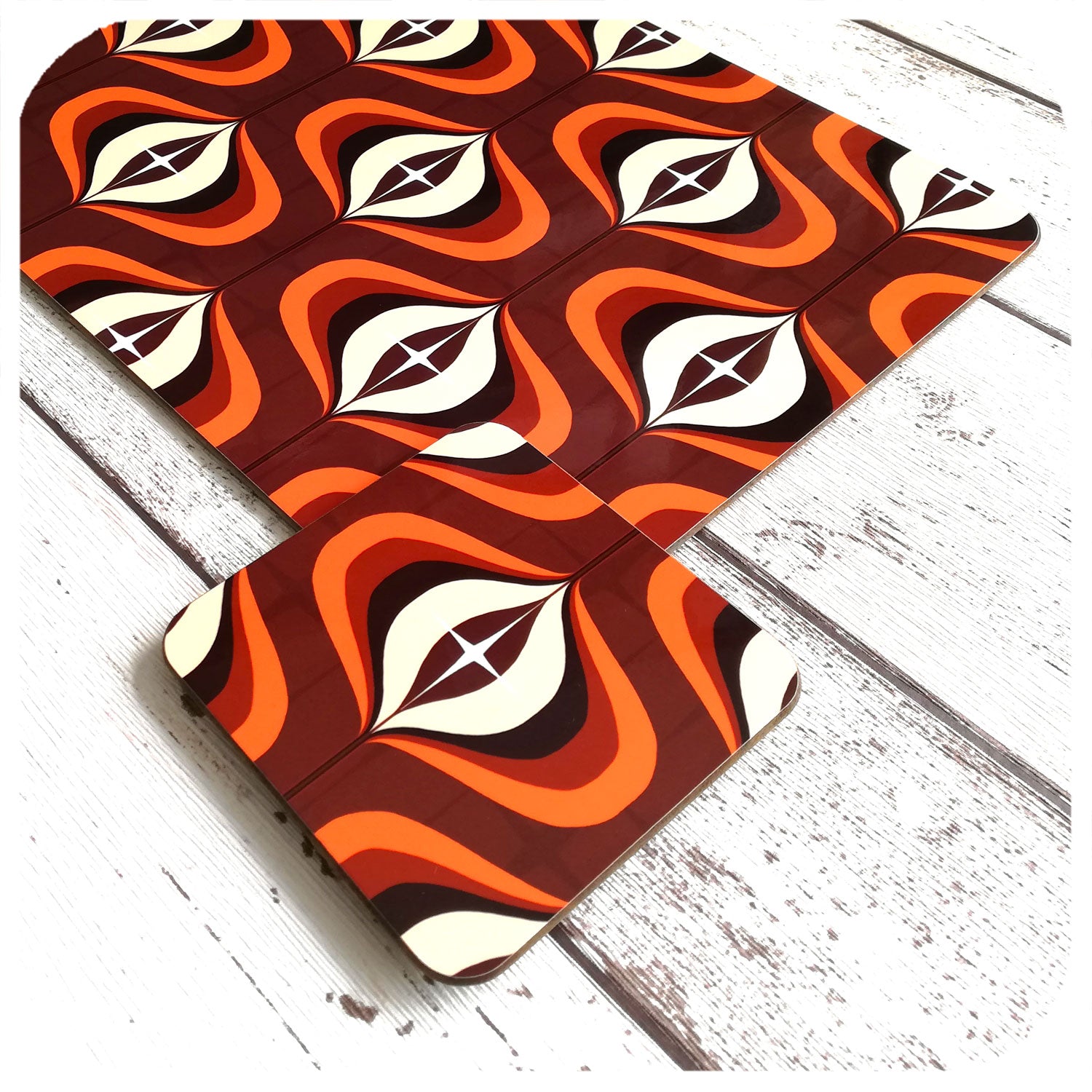 70s style Op Art Placemat & matching Coaster in Orange & Brown, close up at a jaunty angle | The Inkabilly Emporium