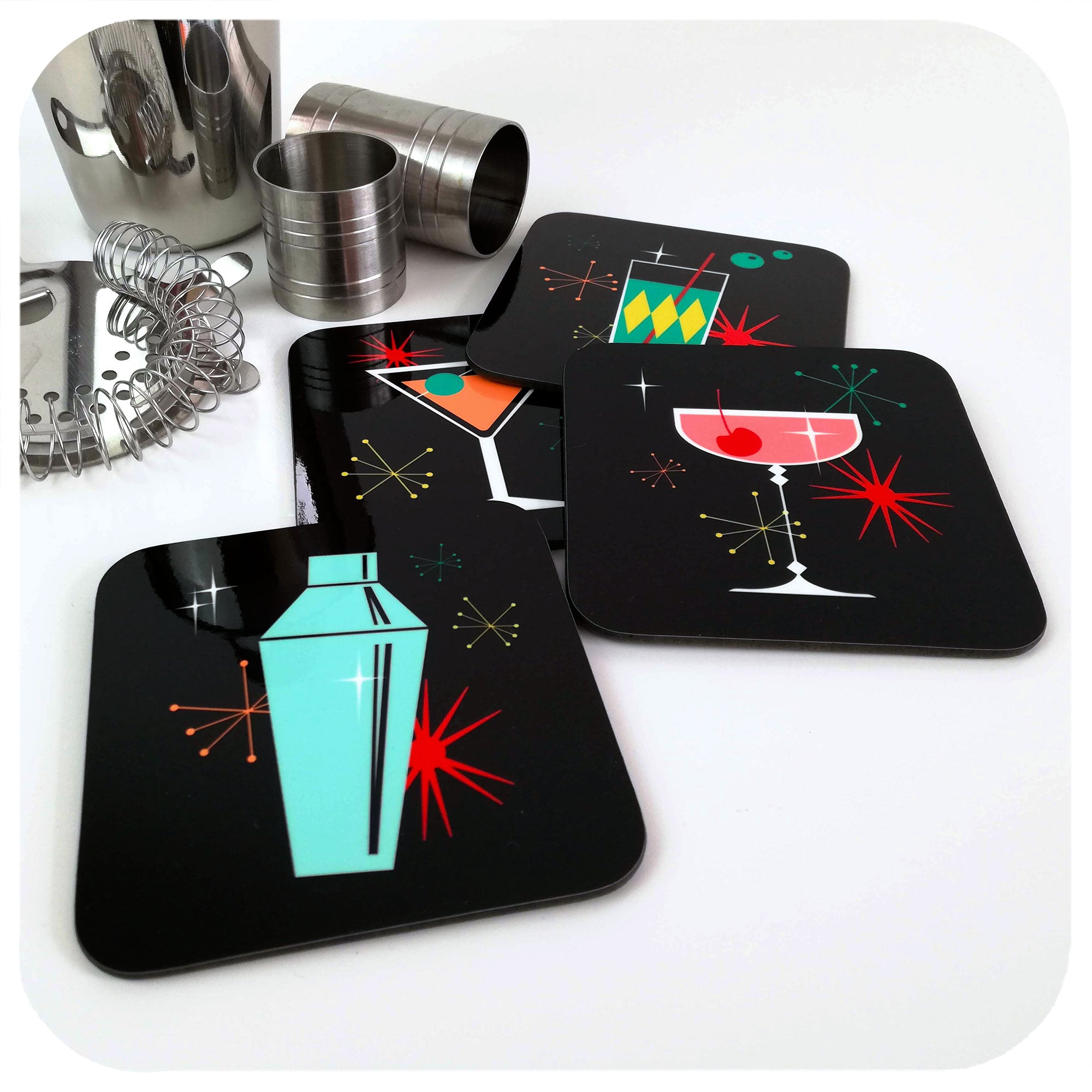 Cosmic Cocktail Coasters - Set of 4, on table with cocktail accessories | The Inkabilly Emporium