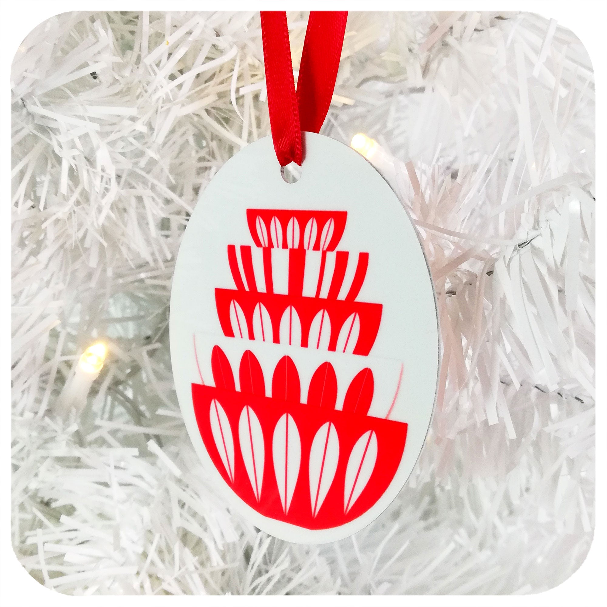 Catherineholm Bowl Stack Christmas Decoration in white & red, hanging by red ribbon on a white Christmas tree | The Inkabilly Emporium