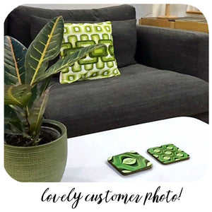 Green 70s Op Art coasters on coffee table with vintage cushion on sofa - photo  by customer | The Inkabilly Emporium