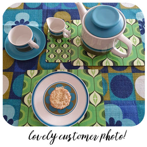 Green Op Art placemats and coasters on a 70s table cloth with vintage crockery - photo  by customer | The Inkabilly Emporium