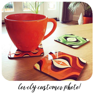 Customer photo of Op Art Coasters with orange mug | The Inkabilly Emporium