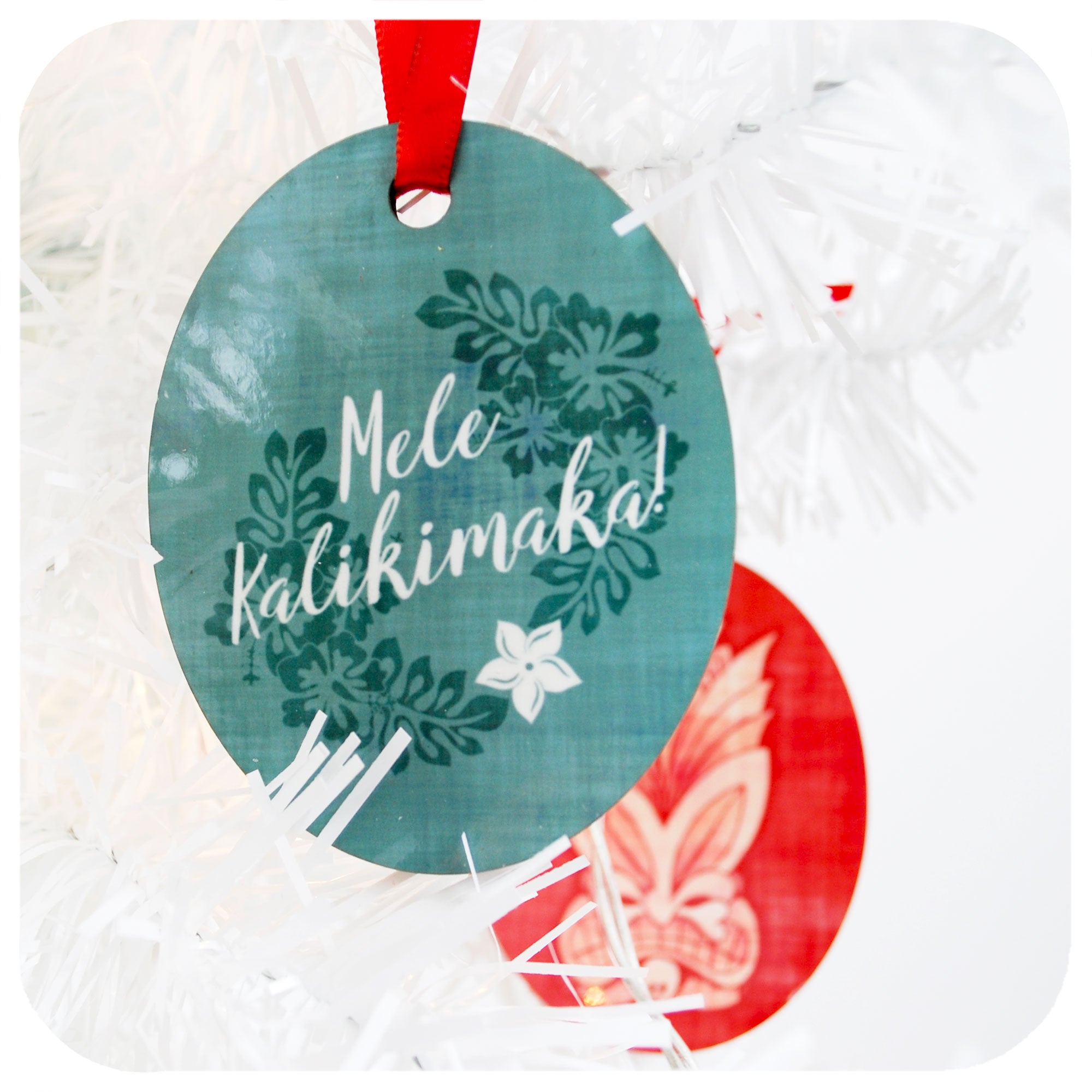  Blue Tiki Christmas Decoration, back reads Mele Kalikimaka | The Inkabilly Emporium