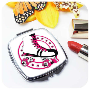 Retro Roller Skate Compact Mirror in Pink on table with lipstick and flower | The Inkabilly Emporium