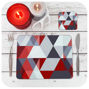Scandi Geometric placemat and matching coaster, in red & grey. Set on a table with festive candles and christmas table decor | The Inkabilly Emporium